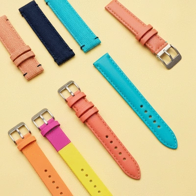 Assortment of colorful watch straps on a light background, showcasing different materials and styles for summer, no text, no words, no typography, no labels, clean image