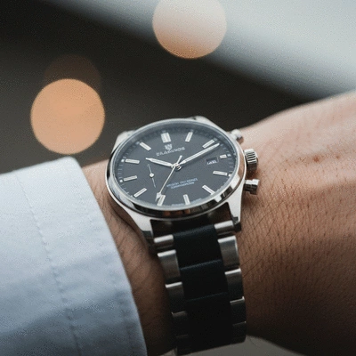 Close-up of a stylish, affordable luxury watch on a wrist, showcasing craftsmanship