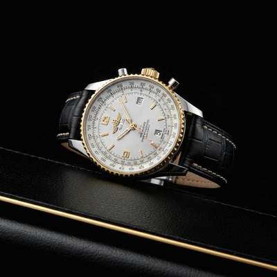 Breitling Navitimer watch on a dark, luxurious surface