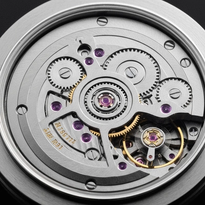 Close-up of a detailed watch movement with gears and springs