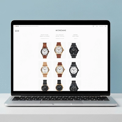 Modern e-commerce interface on a laptop displaying handmade watches for sale